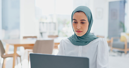 Image showing Corporate muslim woman, laptop or office for email communication, digital marketing or seo with vision. Islamic social media expert, mobile computer or typing at desk in startup for planning in Dubai