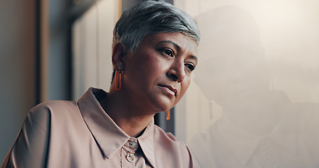 Image showing Shot of a mature businesswoman looking stressed out in an office