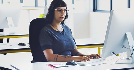 Image showing Creative, serious and computer with woman in office for designer, idea and email. Technology, internet and research planning with employee typing in digital agency startup for data, vision and focus