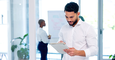 Image showing Businessman, smile and working on tablet in busy office, company and startup agency. Happy worker, digital technology and website planning for internet search, data management and productivity online