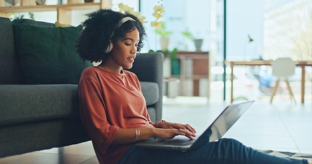 Image showing Black woman, laptop and singing with music headphones in house or home living room to dance audio, radio or podcast. Smile, happy or dancing student with technology for distance learning or education