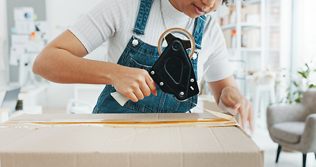 Image showing Woman packing box, package and cargo with tape for delivery, sale and shipping in workshop, startup store and creative studio. Female small business owner prepare product, order and service logistics