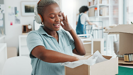 Image showing Black woman, music headphones and dance in office, ecommerce shipping logistics company or creative e commerce startup. Smile, happy and excited retail worker with dropshipping product delivery boxes