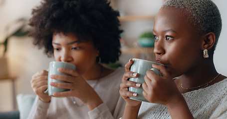 Image showing Chocolate drink and black woman friends on sofa talking and having winter celebration. African people or gen z women enjoying sweet milk coffee or cocoa beverage on couch in their apartment lounge