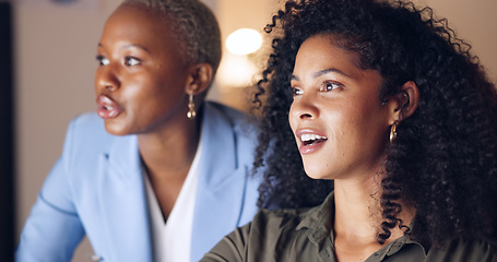 Image showing Training, computer and business women speaking about management of website for company in a dark office. African workers talking, planning and working on a corporate strategy during overtime