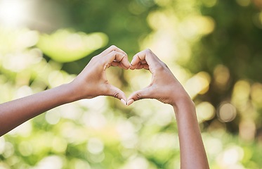 Image showing Hands, heart and sign for agriculture love, nature or eco friendly environment in the outdoors. Hand of person showing hearty shape emoji, symbol or icon for natural sustainability, growth or ecology