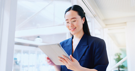 Image showing Business woman, tablet and technology, typing email for company communication or digital report. Internet, wifi and ux, networking and Asian employee with smile and inspiration in Japan office