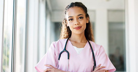 Image showing Face, doctor and black woman with smile, healthcare and wellness in hospital, arms crossed and confident. Portrait, African American female and medical professional in uniform, happy and leadership