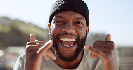 Image showing Portrait, black man and hand, good times sign in a city, smile, relax and happy with freedom, positive and energy. Face, man and shaka hands by African in New York for travel, fun and leisure trip