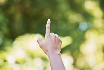 Image showing Hand, nature and sustainability with a woman touching a green background for eco friendly conservation. Finger, spring and ecology with a female outdoor in a natural environment to touch mockup