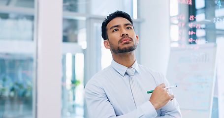 Image showing Thinking, strategy and serious businessman writing on glass wall with thoughtful analysis in office. Brainstorming, planning and vision of corporate worker with focus, concentration and idea.