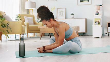 Image showing Fitness, yoga or meditation stretching woman for workout in the living room of her house. Girl with chakra focus, mindset or balance while training, exercise or health with zen pilates for wellness.