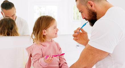 Image showing Father, learning and teaching girl to brush teeth with toothbrush, dental hygiene and gum healthcare. Man, daughter and laughing in bathroom, healthy mouth or wellness with support for cleaning tooth