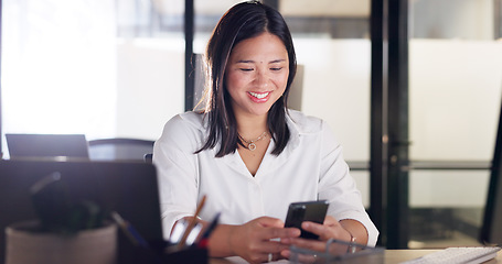 Image showing Business woman, phone and communication of a happy employee networking at a office desk. Company, corporate and worker with happiness texting, typing and working on a mobile phone with social media