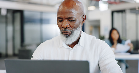 Image showing Laptop, office and african businessman with company financial research, kpi review and online report in focus, mission and goals. Senior corporate employee working on pc technology at desk workspace