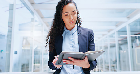 Image showing Business, woman and employee with notebook brainstorming, modern office and writing for research, data analysis and planning. Female entrepreneur, lady and ceo with digital marketing and brainstormin