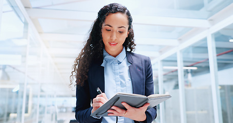 Image showing Business, woman and employee with notebook brainstorming, modern office and writing for research, data analysis and planning. Female entrepreneur, lady and ceo with digital marketing and brainstormin