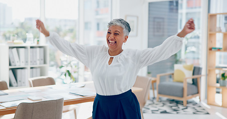 Image showing Dance, success and business woman in an office, corporate celebration and happy with work freedom. Smile, winning and elderly employee funny dancing for promotion, bonus and achievement in career