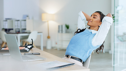 Image showing Business woman relaxing after finally finishing a deadline and working on a laptop alone at work. Pleased black female corporate professional done with a project and sending emails