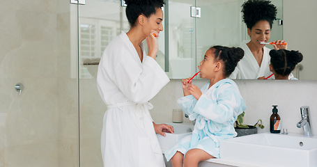 Image showing Dental, bathroom and mother and child brushing teeth for oral health, teeth healthcare and cleaning mouth with toothbrush. Black family morning routine, toothpaste and mom teaching self care hygiene