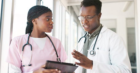 Image showing Healthcare tablet, team and planning with doctor and nurse talking, discussion and communication about medicine. Black man and woman hospital staff meeting with technology for innovation and research