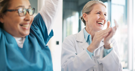 Image showing Doctor, team and applause in celebration for healthcare achievement, goal or success at the hospital. Group of medical professional clapping and celebrating teamwork, unity or victory at clinic