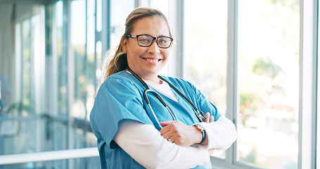 Image showing Portrait, healthcare and trust with a nurse woman in scrubs standing arms crossed while working in a hospital. Medical, health and insurance with a female medicine professional at work in a clinic