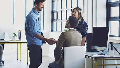 Image showing Handshake, meeting and leadership with businesspeople in office for b2b, collaboration or teamwork. Support, happy and deal with employee shaking hands in digital agency for creative, vision or goals