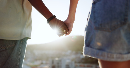 Image showing Summer, love and couple holding hands in the city of Portugal for a holiday together. Support, trust and man and woman with affection, sunshine view and travel on a vacation for adventure with flare