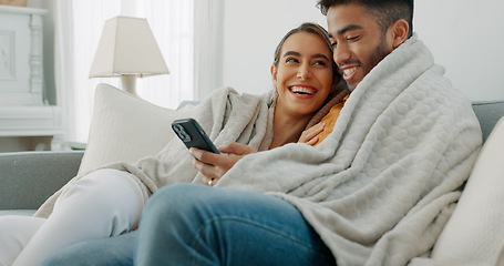 Image showing Happy, couple with phone for communication, networking or social media app at home. Movie, video or love man and woman relax in living room streaming online, internet or website with smile in house