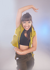 Image showing Dance, comic and portrait of a woman with a move isolated on a bokeh studio background. Smile, carefree and dancer dancing with energy, crazy and comedy with confidence and laughing on a backdrop