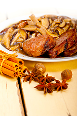 Image showing venison deer game filet and wild mushrooms