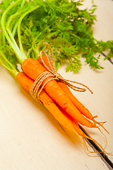 Image showing baby carrots bunch tied with rope