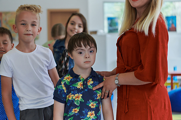 Image showing Preschool children wait in line for new and interesting games. Selective focus