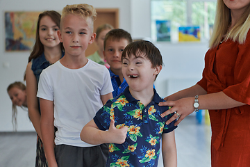 Image showing Preschool children wait in line for new and interesting games. Selective focus