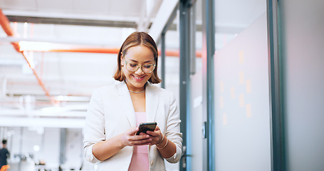 Image showing Business woman, office phone and communication of a employee walking with a smile. Corporate worker on technology for social media, web and internet scroll at work with happy texting on a break