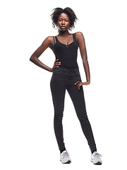 Image showing Fashion, portrait and African girl model in a studio with a casual outfit, confidence and natural pose. Beauty, young and proud black woman with an afro posing while isolated by a white background.