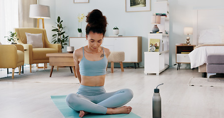 Image showing Fitness, yoga or meditation stretching woman for workout in the living room of her house. Girl with chakra focus, mindset or balance while training, exercise or health with zen pilates for wellness.