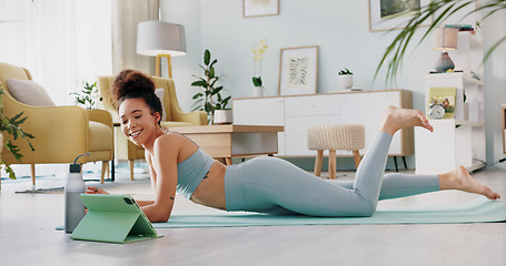 Image showing Yoga, woman and tablet for wellness, zen and mindfulness on floor in home, apartment or house. Black woman, stretching and exercise for wellness, health and fitness from class on internet, app or web