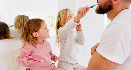 Image showing Girl children, father and brushing teeth for bonding and being happy for bathroom, playful and laugh together. Growth, child development and dad teach female kids oral hygiene, healthcare and dental.