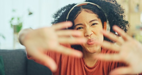 Image showing Black woman, dancing and headphones on sofa, being content and singing words in living room. Young girl, headset and digital device for contemporary dancer, moving with rhythm and relax on break.