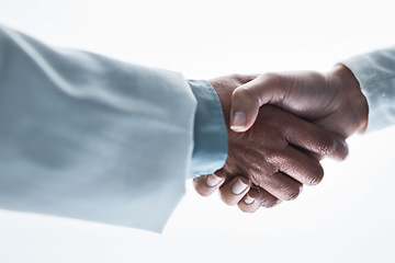 Image showing Doctors, women and handshake on isolated white background for healthcare, wellness deal or teamwork collaboration. Zoom, medical and partnership gesture in hospital welcome, people trust or thank you