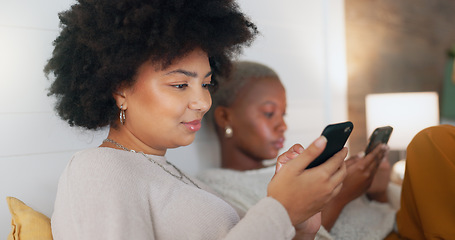 Image showing Social media phone, home relax and friends in communication on mobile app, search the internet and smile for notification. African women on the living room sofa with mobile internet connection