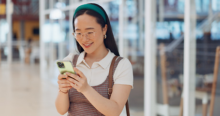 Image showing Phone, mall and Asian woman typing, social media or messaging. Technology, coffee and happy female with mobile smartphone for networking, internet browsing or web scrolling alone at shopping mall.