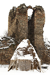 Image showing old farm haystack with ruined castle