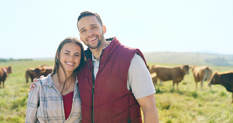 Image showing Cow, love and happy couple on a cattle farm hugging, bonding and enjoy quality time outdoors in nature. Smile, portrait and woman farming cows and harvesting animal livestock with a farmer on field