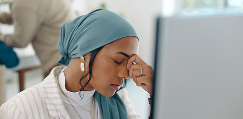 Image showing Hijab, headache and business woman burnout at a office computer feeling anxiety and stress. Finance employee, islam and muslim female at work doing tax audit at a computer worried about mistake