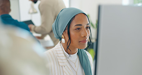 Image showing Woman, startup and desk with computer, reading and coding in modern office with islamic headscarf. Muslim programming expert, developer and web design worker with vision, tech solution and happiness