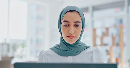 Image showing Islamic woman, laptop and focus working in office with hijab for religion, reading online communication or arabic company manager. Muslim, entrepreneur and planning on digital tech with head scarf