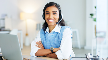 Image showing Portrait of a call center agent using a headset while consulting for customer service and sales support. Confident young businesswoman smiling while operating a helpdesk and looking confident